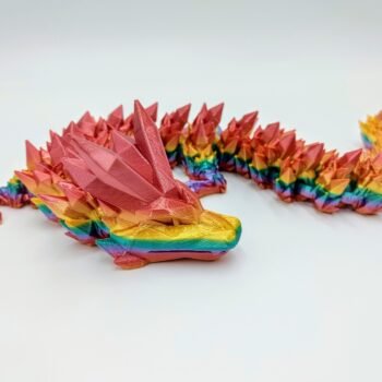 Articulated Crystal Dragon Sensory Toy in Silk Coober Pedy Rainbow with a White Background Closeup with a White Background