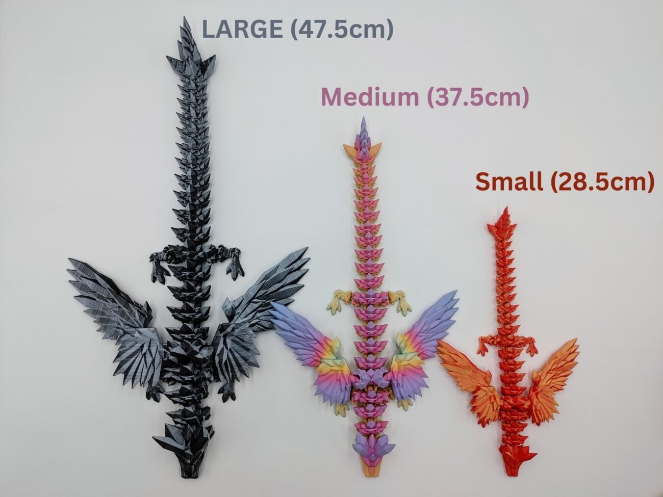 Articulated Crystalwing Dragon 3D Printed in Three Matte Sizes Articulated Crystalwing Dragon Sensory Toys Designed by Cinderwing3d in Three Matte Sizes with a White Background