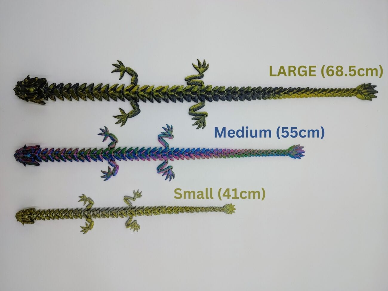 Articulated Imperial Dragon 3D Printed in Three Silk Sizes Articulated Imperial Dragon Sensory Toys in Three Silk Sizes with a White Background