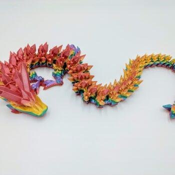 Crystal Dragon 3D Printed in Coober Pedy Rainbow Articulated Crystal Dragon Sensory Toy in Silk Coober Pedy Rainbow with a White Background